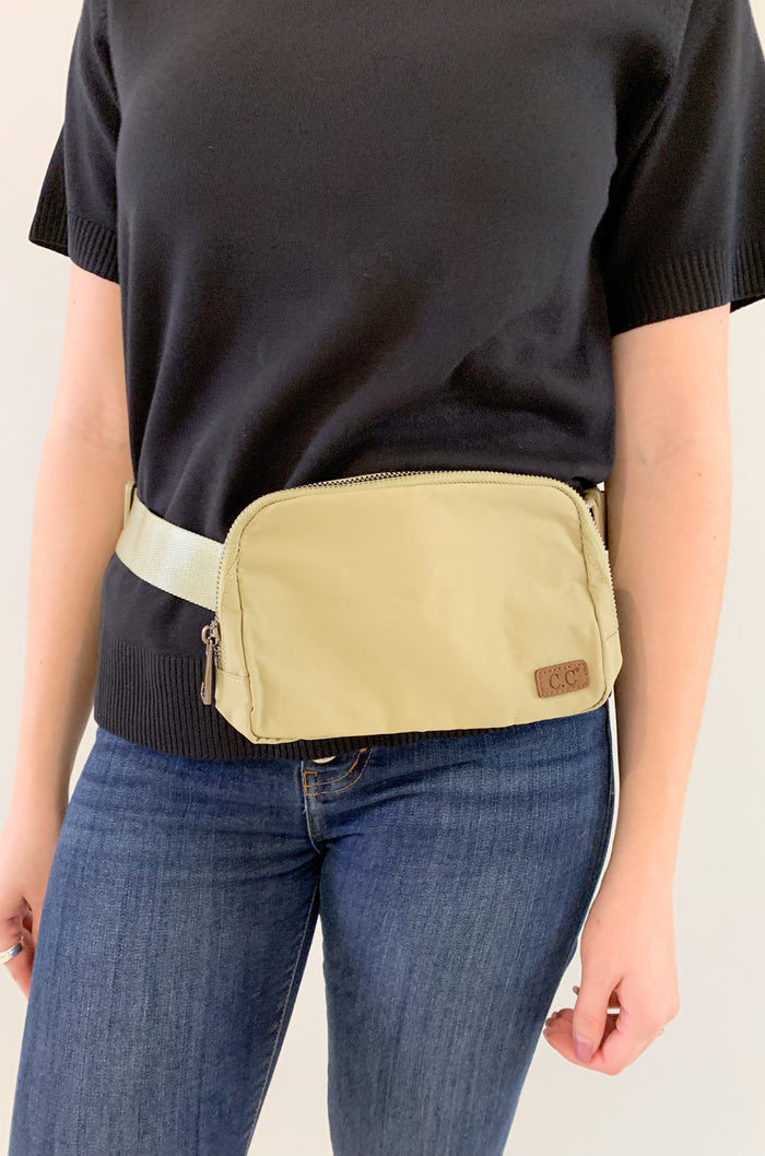 The C.C Waterproof Mini Belt Bags are made for women on the go! You can wear them as a traditional "fanny pack" belt bag, or try the sling bag trend. Either way, this mini accessory is hands free and effortless. It has multiple inner storage compartments with an extra exterior zipper pocket on the bag. On the front, there is a small brown faux leather cc logo.