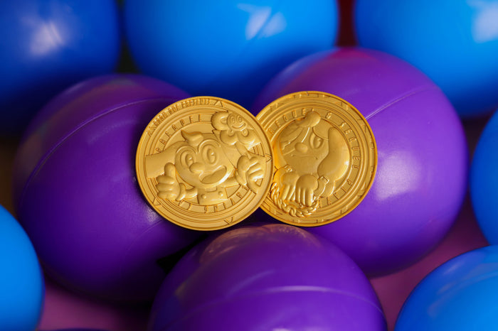 Two Prequel & Sequel Collector's Coins with cartoon characters on purple and blue balls