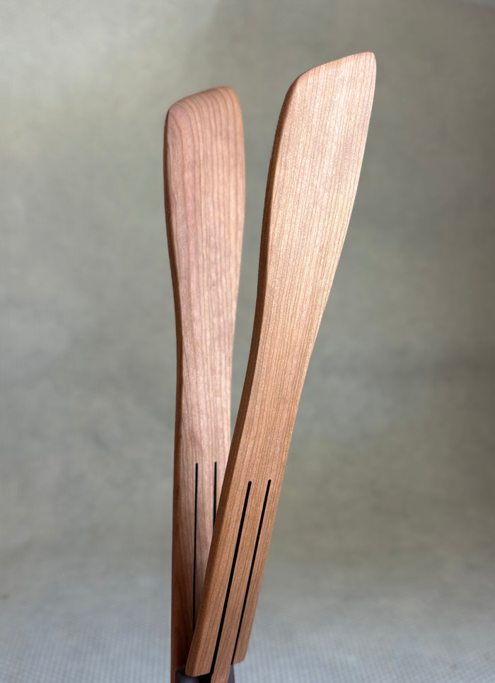 wooden inside out tongs on light neutral background. Jonathan's Spoons.