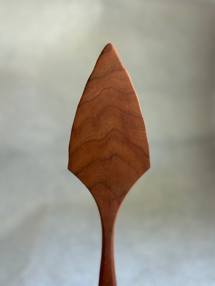 Jonathan's Spoons natural wooden pie server on light natural background.