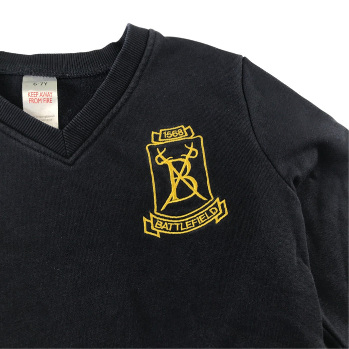 Second-hand Battlefield Primary School navy jersey V-neck sweatshirt, flat lay view with embroidered badge.