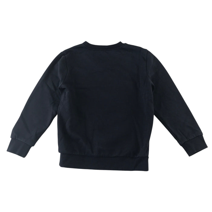 Second-hand Battlefield Primary School navy jersey V-neck sweatshirt, flat lay view with embroidered badge.