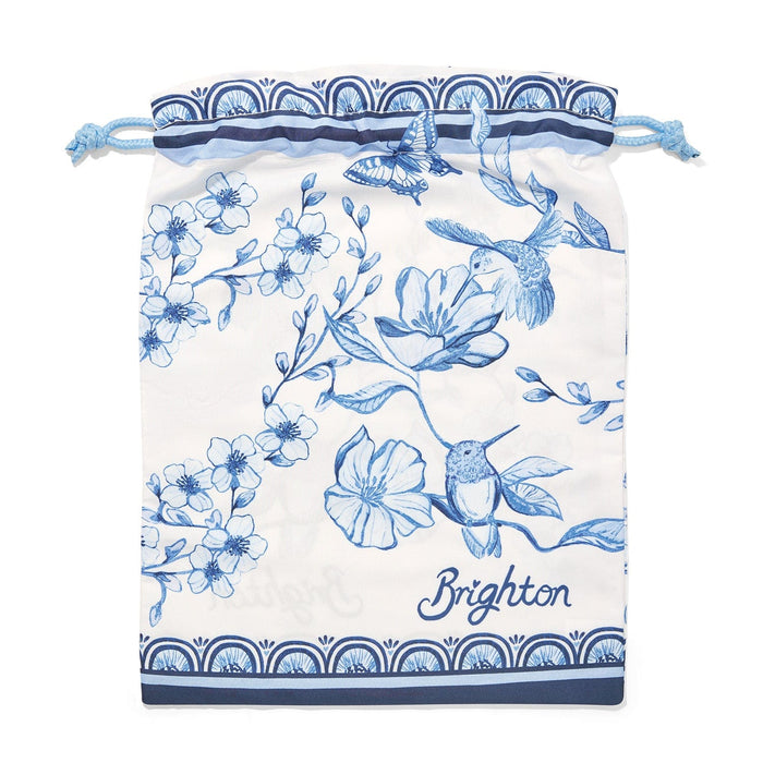 Brighton drawstring pouch with blue floral, hummingbird, and butterfly print on white background