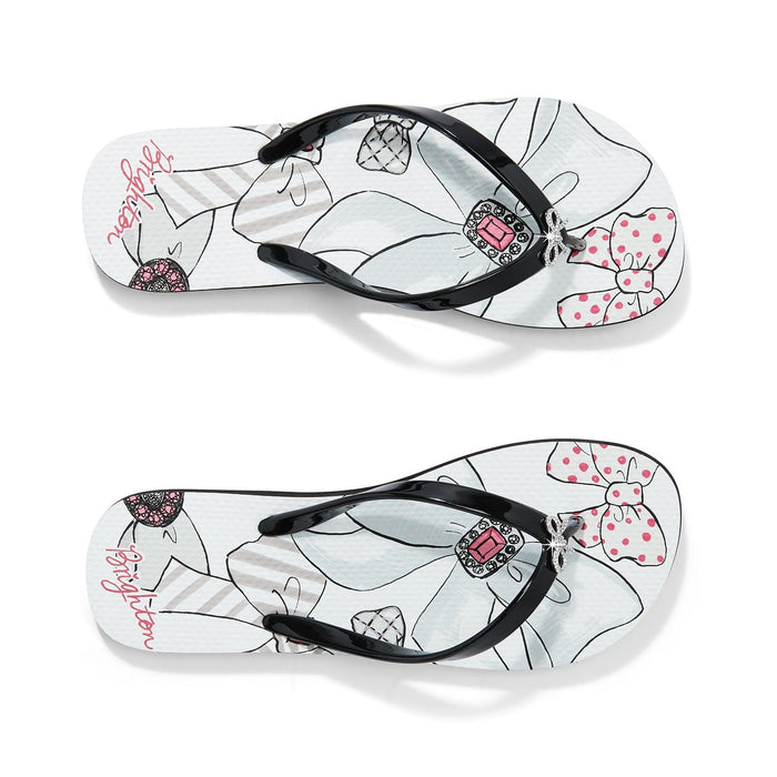 Brighton black rubber flip-flops with floral print footbed, pink crystal embellishment, and bow accents on a white background
