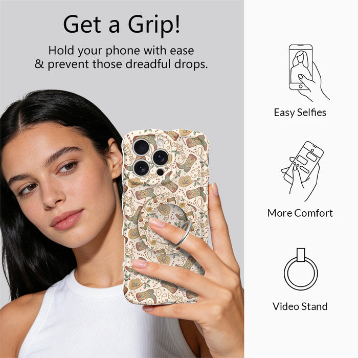 Woman taking a selfie while holding an iPhone by the Boot Scootin' Christmas grip ring; easy selfies, more comfort and video stand