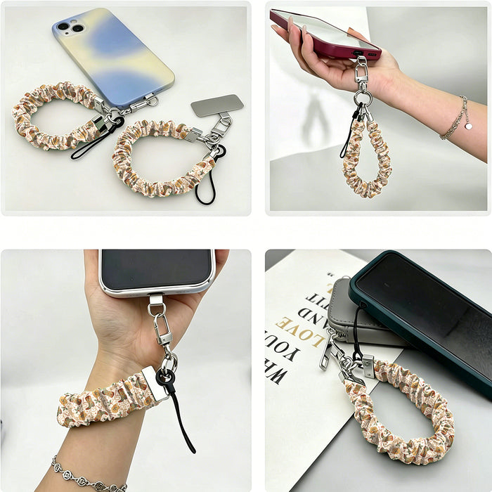 Four views of the Boot Scootin' Christmas scrunchie phone wrist strap: with its phone tab, dangling from a phone in hand, worn on the wrist, and clipped to a pouch zipper