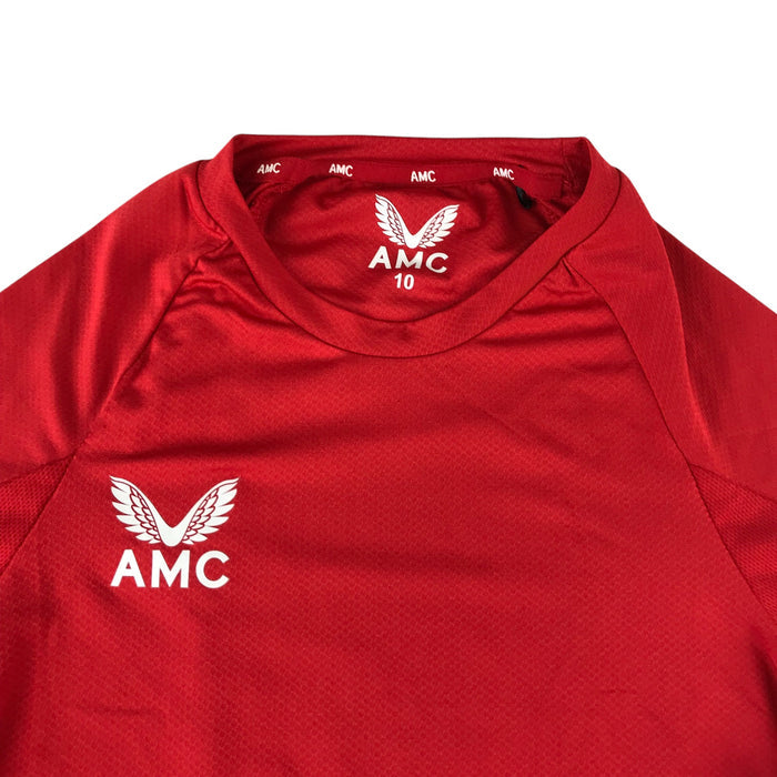 Castore 9-10 years red white sports top