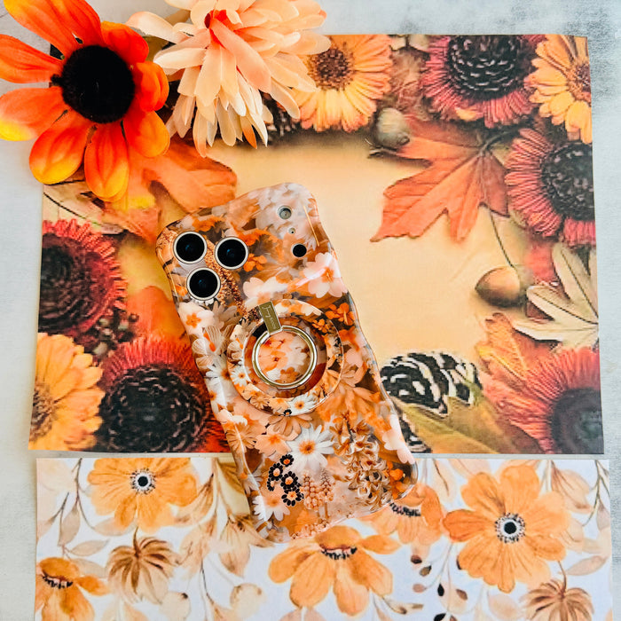 Fall Blooms Hold It Fancy MagSafe grip ring with a warm autumn floral print, shown with the matching iPhone case