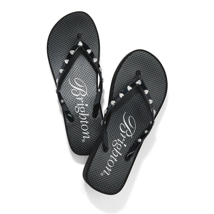Brighton black rubber flip flop sandals with silver-tone heart studs along the straps on a white background