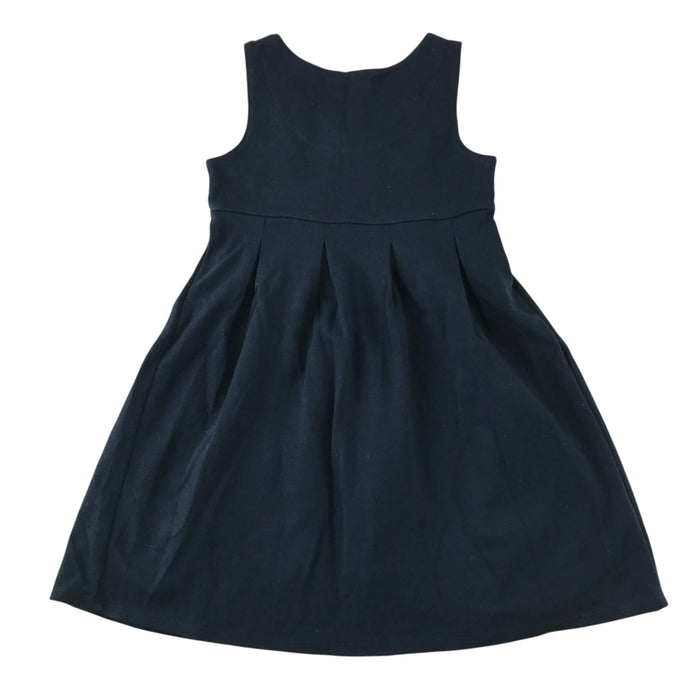 Front and back views of a second-hand girls navy blue jersey pinafore school dress