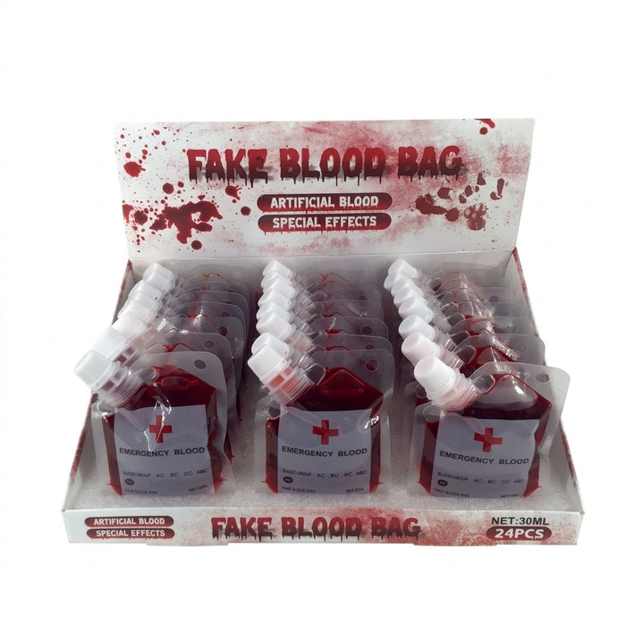 A retail display box containing 24 small fake blood bags labeled 'FAKE BLOOD BAG' and 'ARTIFICIAL BLOOD SPECIAL EFFECTS' with 'EMERGENCY BLOOD' on the front labels.