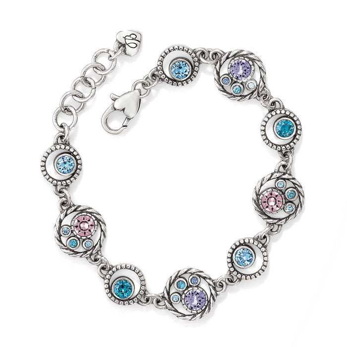 Brighton silver-plated bracelet with circular links featuring blue, pink, and purple crystals on a white background