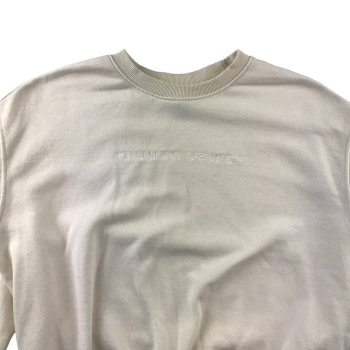 H&M women's XS cream embroidered human being sweater