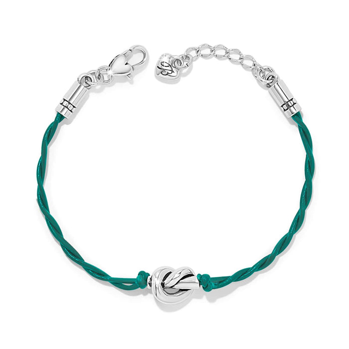 Brighton bracelet with teal leather cord and silver-plated knot centerpiece with lobster clasp on a white background