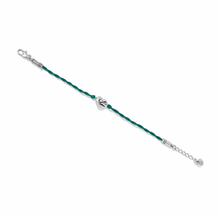 Brighton bracelet with green leather cord and silver-plated knot accent and lobster clasp on a white background