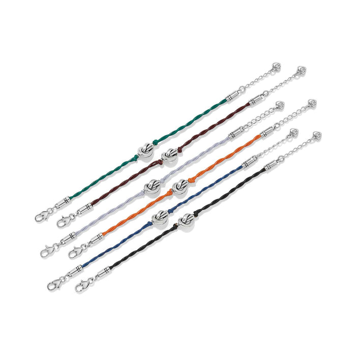 Brighton bracelets in green, brown, lavender, orange, blue, and black leather cord with silver-plated knot accents on a white background