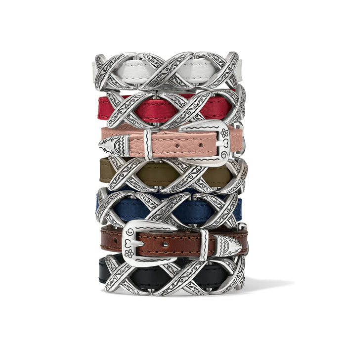 Brighton leather bracelets stacked in white, red, pink, olive, blue, brown, and black with silver-plated buckles on a white background