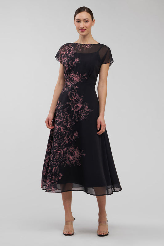 Black dress with pink floral embroidery on a white background