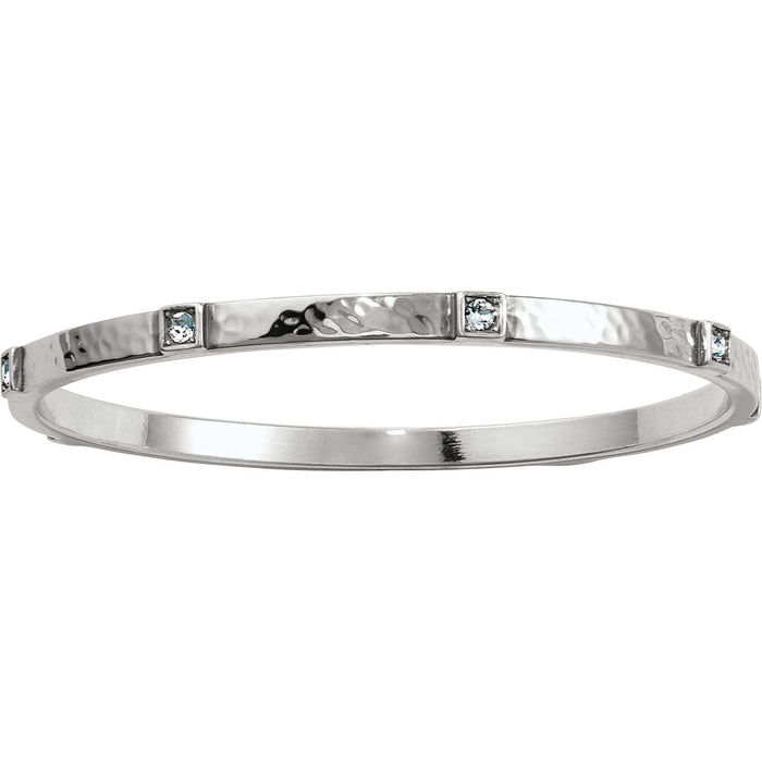 Brighton bangle bracelet with hammered silver-tone finish and small blue crystal accents on a white background