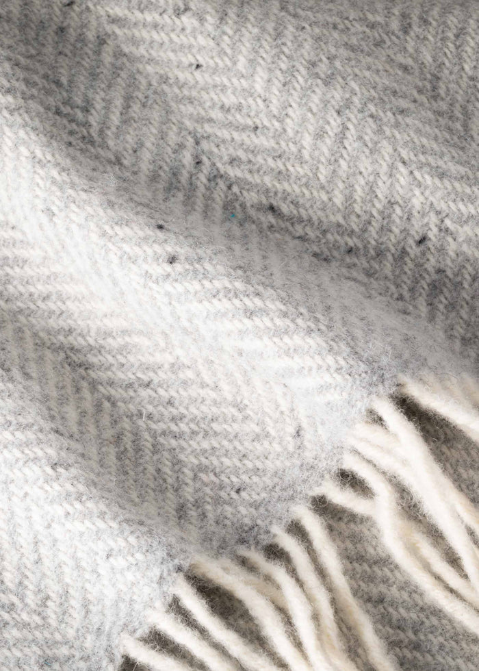 Close-up of a textured gray fabric with fringes