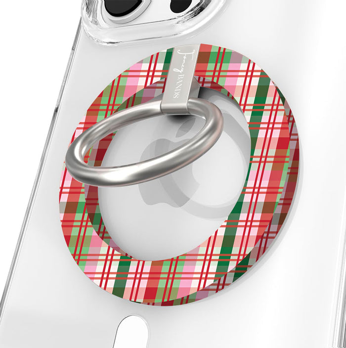 Close-up of the Merry Little Plaid MagSafe grip ring in pink, red and green Christmas plaid with a brushed silver ring on a clear iPhone case