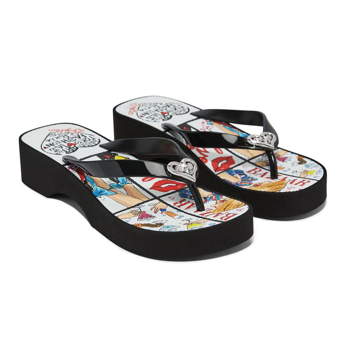 Brighton black rubber platform flip-flop sandals with illustrated comic print footbed and silver-tone heart accents on a white background