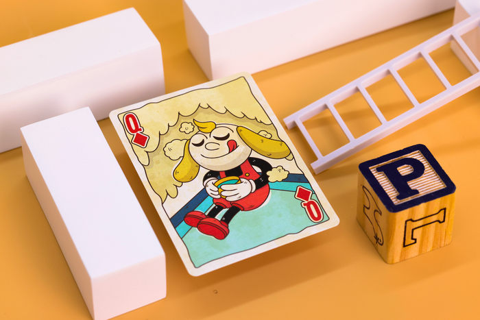 Prequel Edition Court Card with a cartoon character enjoying a nice beverage on a yellow surface next to wooden blocks