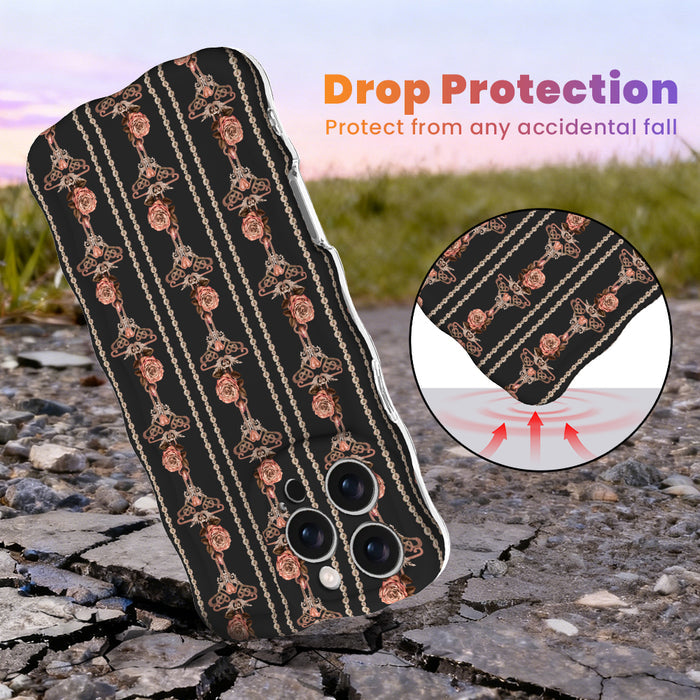 Pretty Little Details black Wavy Luxe MagSafe iPhone case with champagne pearl strands and rose gold rose drops, standing on cracked rock at sunset with an inset of the cushioned drop-protection edge.
