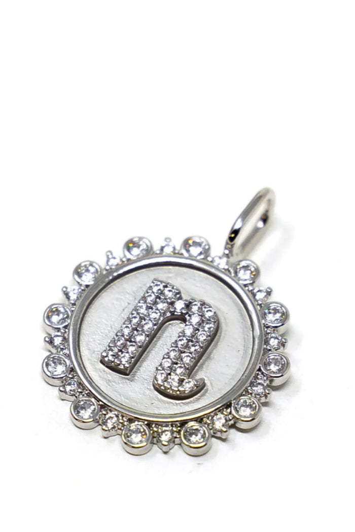 Choose your favorite chain and charms! The Sis Kiss coin initial pendant is vintage inspired and accented with crystals. It's the perfect silver statement jewelry piece and a fun way to customize your look.