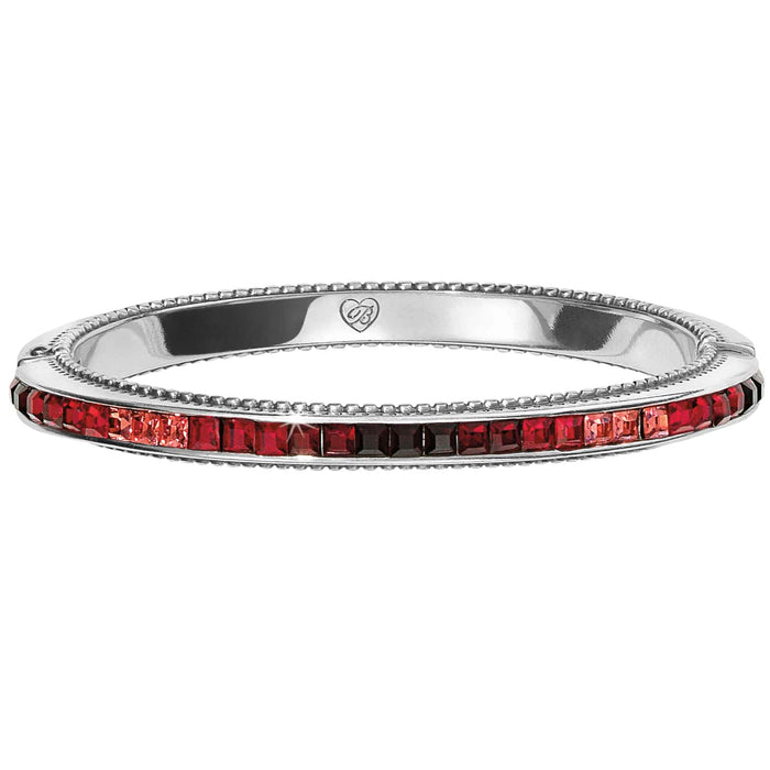 Brighton bangle bracelet with silver-plated finish and channel-set red and pink crystals on a white background