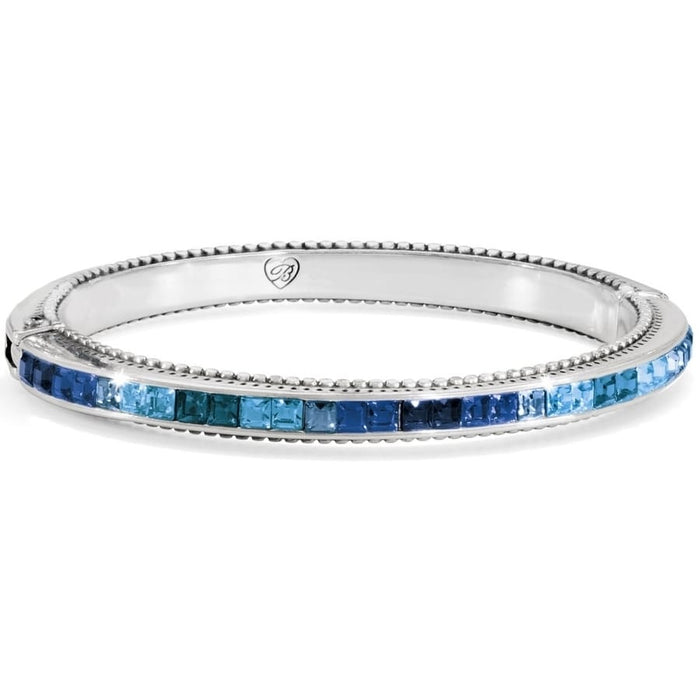Brighton bangle bracelet with silver-plated finish and channel-set blue crystals in varying shades on a white background
