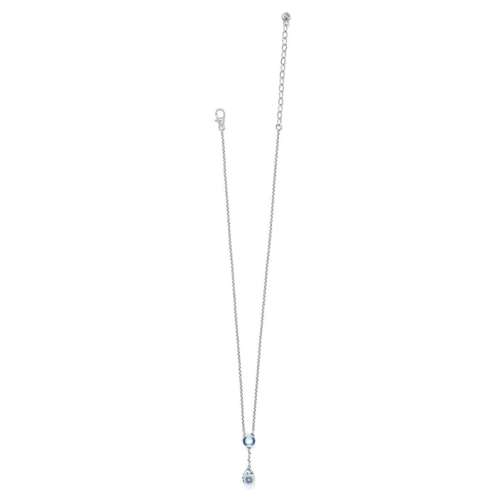 Brighton silver-plated necklace with blue enamel ring station and floral teardrop pendant on a white background