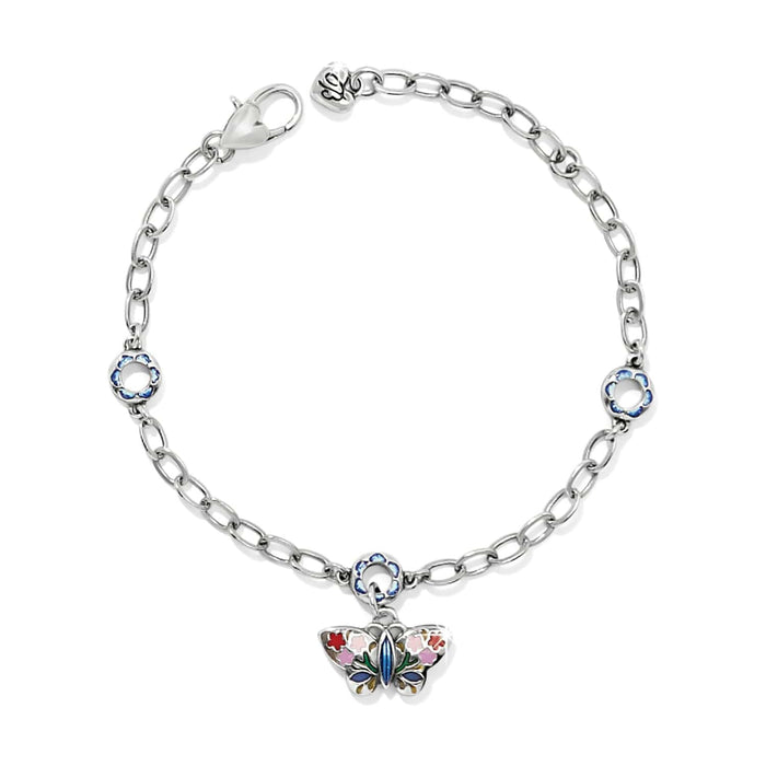 Brighton charm bracelet with silver-plated chain, enamel flower stations, and butterfly charm with floral enamel detail on a white background