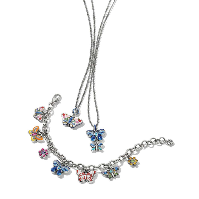 Brighton silver-plated butterfly necklaces and charm bracelet with enamel and crystal floral details on a white background