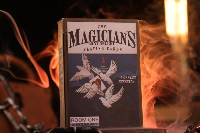 The Magician's Last Secret Diamonds Edition Playing card tuck box with 'The Magician's Last Secret' branding on a dark background with flames.