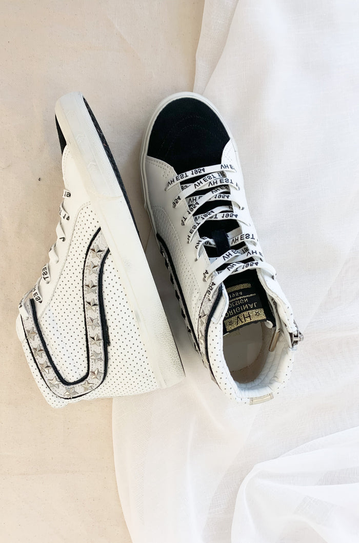 The Vintage Havana Gadol High Top Sneaker is just "WOW"!! It has so many incredible details that make this sneaker stand out. This style has a classic high top shape, star studs along the sides, and a black suede contrast on the front. It is an all out cool-girl shoe.