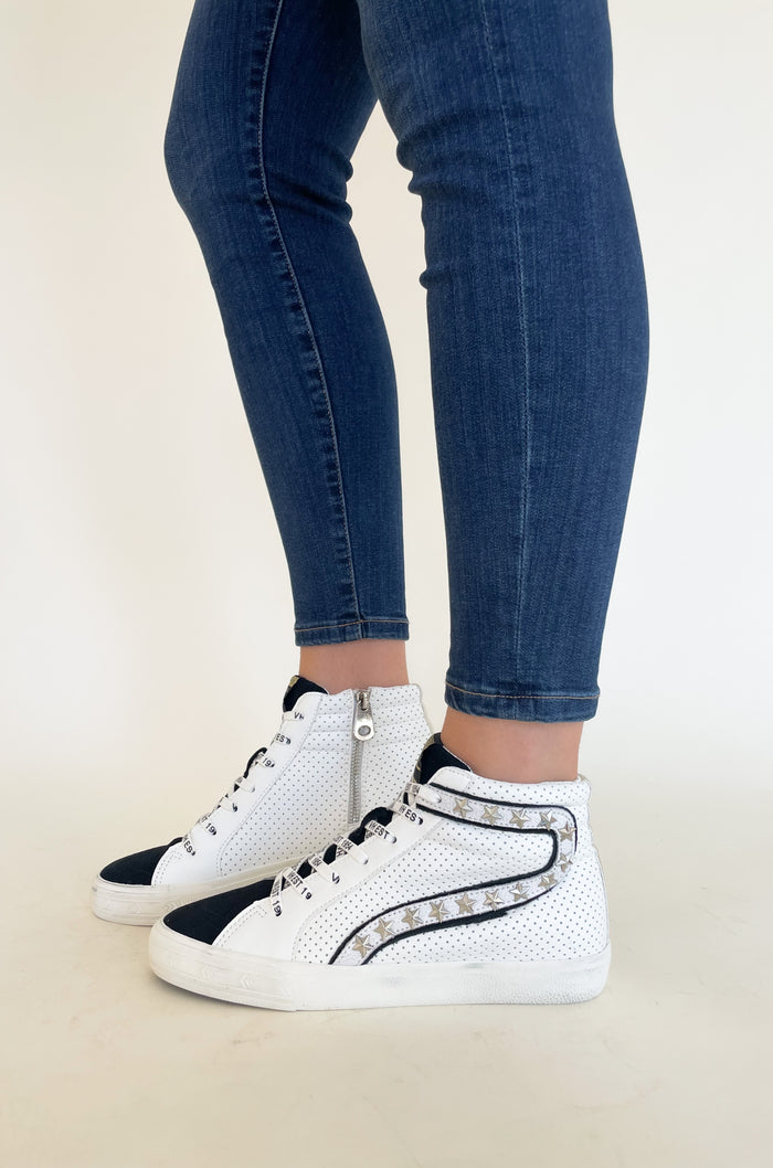 The Vintage Havana Gadol High Top Sneaker is just "WOW"!! It has so many incredible details that make this sneaker stand out. This style has a classic high top shape, star studs along the sides, and a black suede contrast on the front. It is an all out cool-girl shoe.