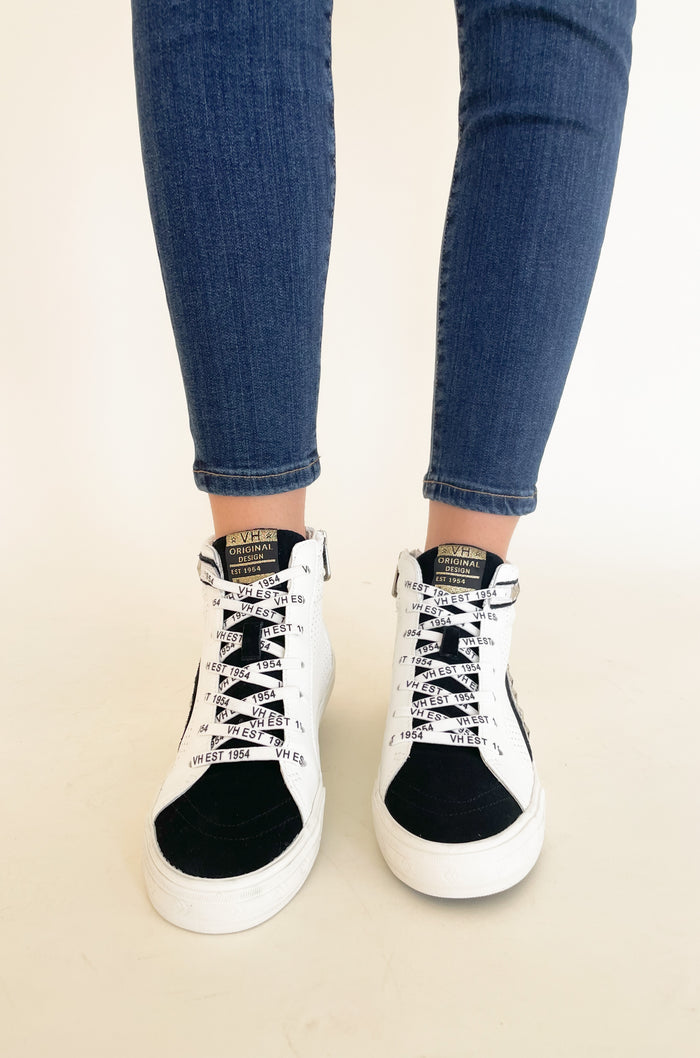 The Vintage Havana Gadol High Top Sneaker is just "WOW"!! It has so many incredible details that make this sneaker stand out. This style has a classic high top shape, star studs along the sides, and a black suede contrast on the front. It is an all out cool-girl shoe.