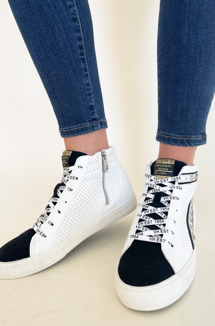 The Vintage Havana Gadol High Top Sneaker is just "WOW"!! It has so many incredible details that make this sneaker stand out. This style has a classic high top shape, star studs along the sides, and a black suede contrast on the front. It is an all out cool-girl shoe.